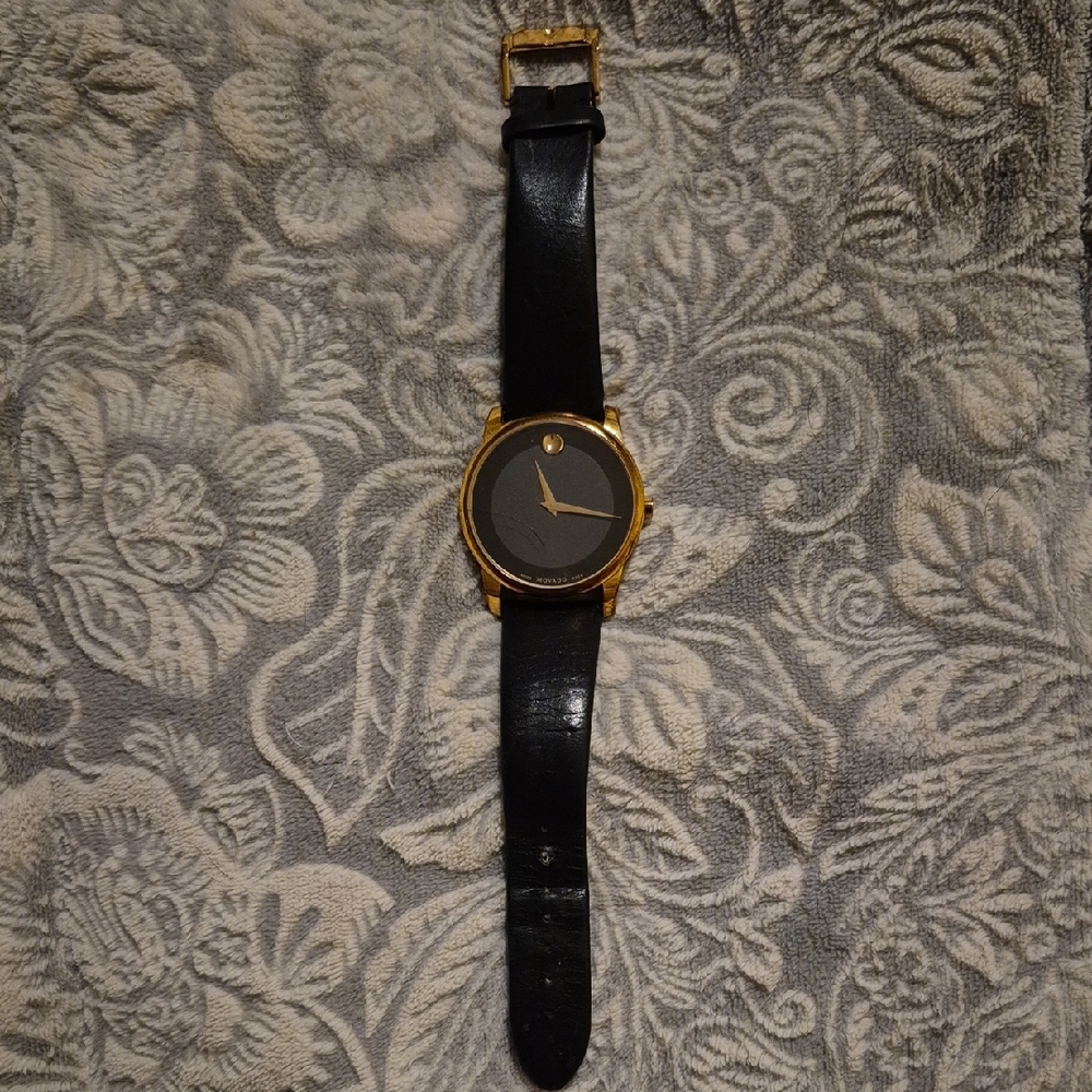 Movado Elegant Black and Gold Watch
